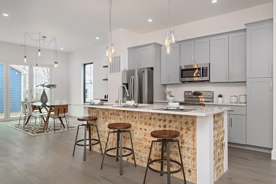 Kitchen Large Island Featuring Undermount Lighting