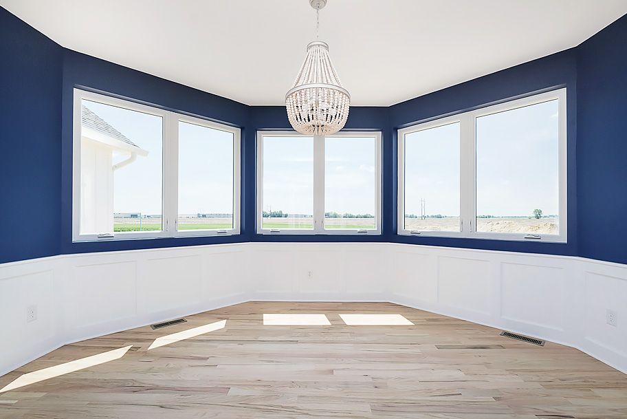Modern Blue Dining Room with Large Windows