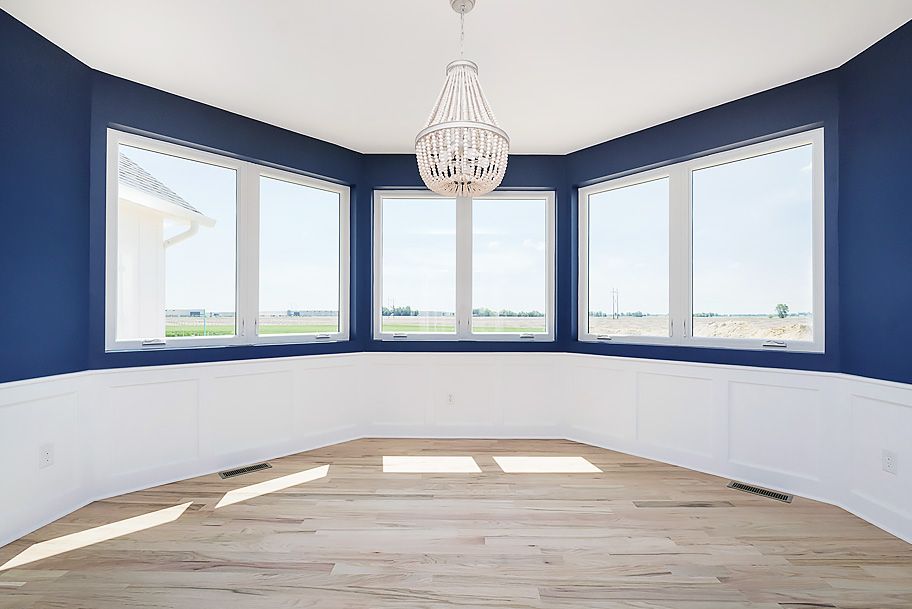 Modern Blue Dining Room with Large Windows