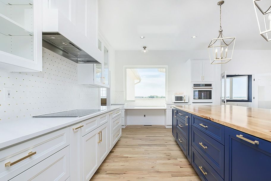 Custom White Kitchen Cabinets and Blue Island