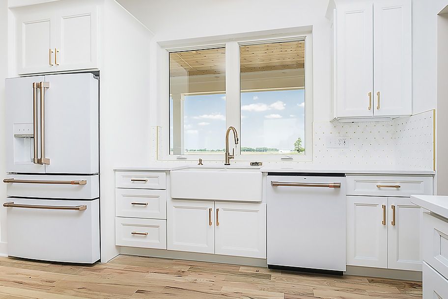 Custom Paneled Appliances to Match White Cabinets