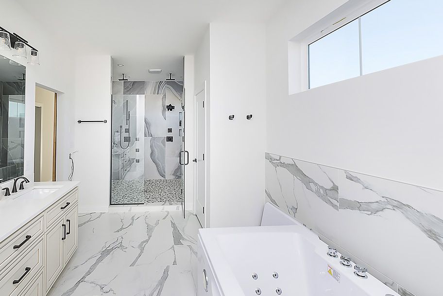 Master Bathroom with Large Vanity, Tub, and Shower