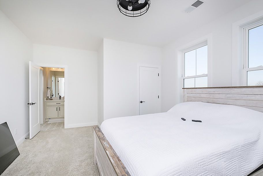 Bedroom with Modern Light Fixture