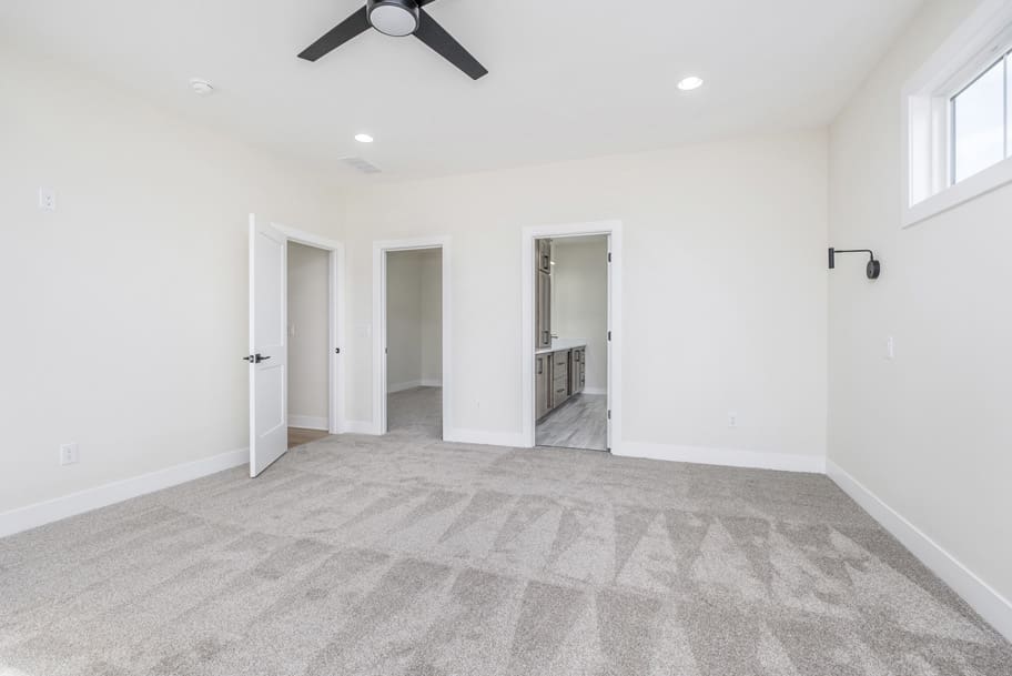 Primary Bedroom with Bathroom and Walk-In Closet