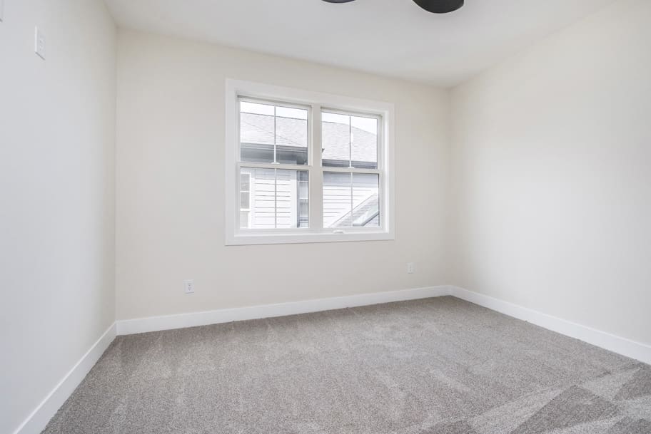 Guest Bedroom with Carpet and Window