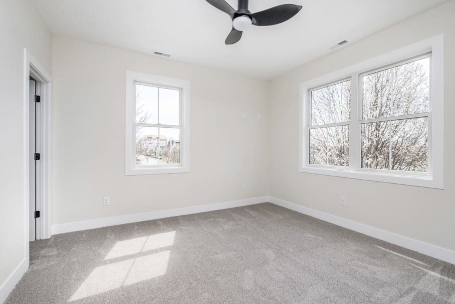 Bedroom with Windows and Modern Ceiling Fan