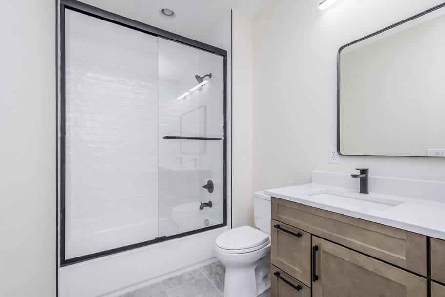 Guest Bathroom With Shower, Toilet, and Sink by Gem Homes