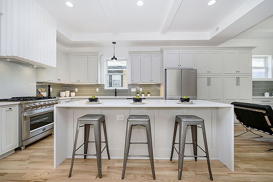 New Construction Home by Gem Homes in Indianapolis with a White Kitchen and Green Backsplash