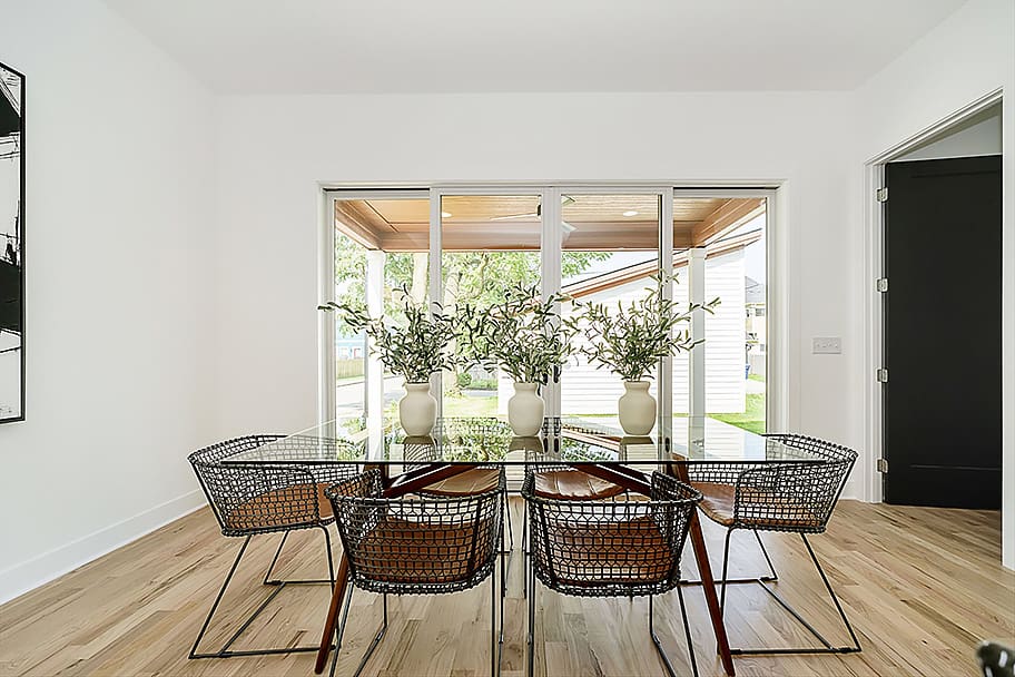Dining Room with Bifold Doors Leading to Covered Back Porch