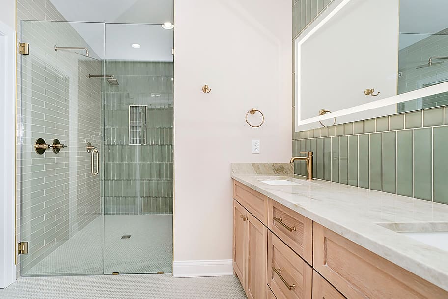 Modern Sage Green Dream Bathroom with Brass Fixtures
