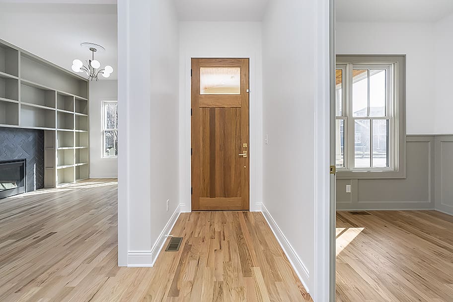 Oak Front Door with View into Front Two Rooms of a Custom Home by Gem Homes Indianapolis