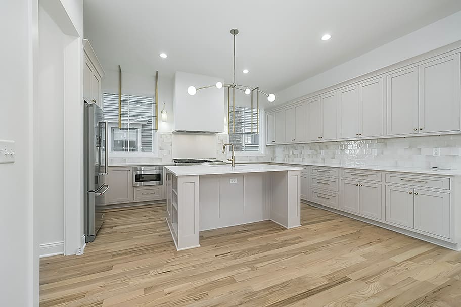 Beige-Pink Kitchen with Glossy Beige Square Backsplash and Gold Accents in a Custom Home by Gem Homes Indianapolis